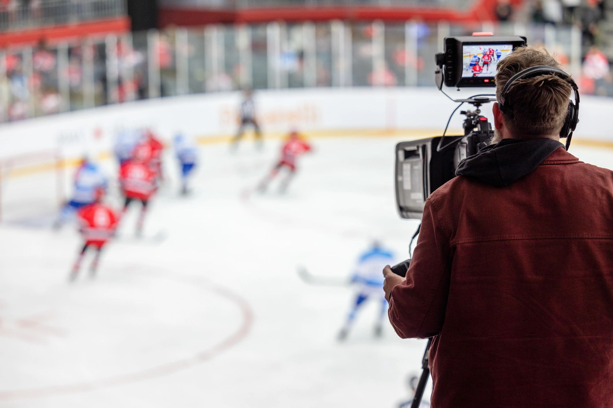 sports photographer at ice hockey rink